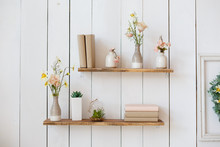 Shelf With Flowers And Books