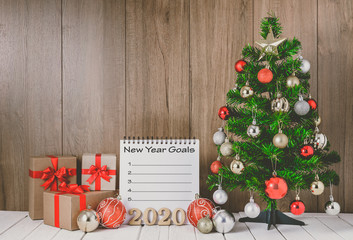 Wall Mural - christmas tree with colorful balls ornaments and gift boxes with Notebook