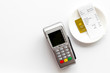 © 9dreamstudio - Electronic payments in restaurant. Bank card near aquiring terminal and bill on white background top view copy space