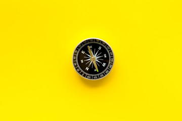 Wall Mural - Compass - small and stylish - on yellow background top view copy space
