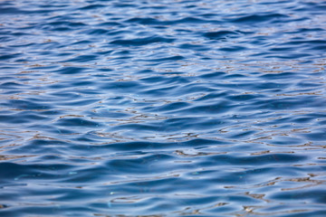 Blue expanse of water at sea as abstract background