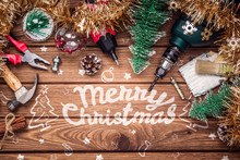 Merry Christmas And Happy New Years Handy Constrcution Tools Background Concept. Handy House Fix DIY Handy Tools With Christmas Ornament Decoration On A Rustic Wooden Table. 