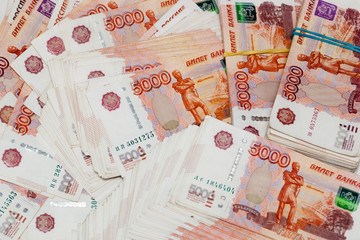 Wall Mural - Russian paper banknotes with a face value of 5,000 rubles. Many Russian banknotes are laid out on a white surface. Background