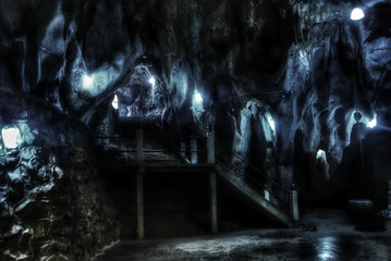 Stairway in the cave and the light from the lamp