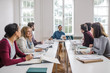 © LStockStudio - Business People Having a Meeting
