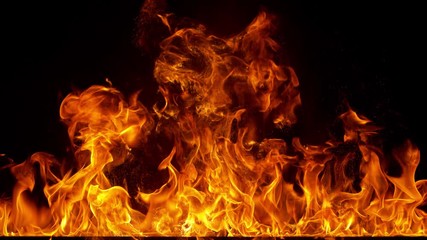 super slow motion shot of fire flames isolated on black background at 1000fps.