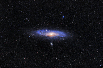 andromeda galaxy (m31) and its satellite galaxies (m32 and m110) in andromeda constellation against 