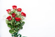 Beautiful bouquet of red roses and baby's breath white flowers isolated on a white background, top view with copy space.