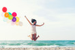© freebird7977 - Asian  woman happy  jumping with balloon congratulation celebrate in Happy New year 2020 for change new life future.  Freedom lifestyle jump as part of Number 2020 success on  sand beach outdoor.