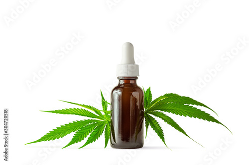 Fotografía Glass Bottle of CBD or THC Oil with Hemp or Medical Cannabis Plant Leaves Isolat