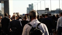 Group Of Business Commuters Walking Towards Station In Sunset 4k Diverse London Population 