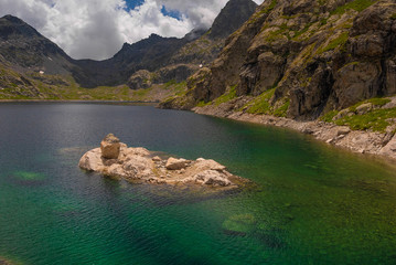 Wall Mural - French Alps at an altitude of 2800 meters, Mountain peaks and untouched nature, clear lakes