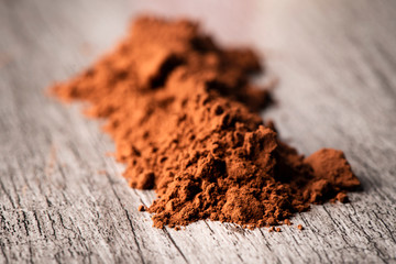 Poster - cocoa powder on a table