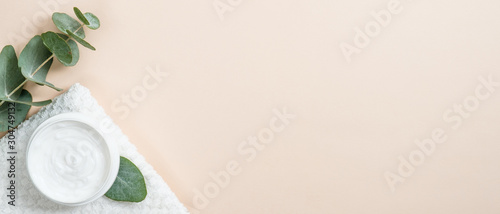 Cuadros en Lienzo Jar of organic cream with eucalyptus leaves on beige background