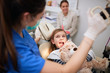 © luckybusiness - Little child at stomatology. Girl with dentist.Family  Health teeth concept.
