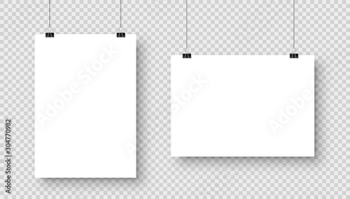 Fotografía Realistic hanging blank paper sheet with shadow in A4 format and black paper clip, binder on checkered background