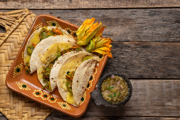 Sticker - Mexican quesadillas with squash blossom on wooden background