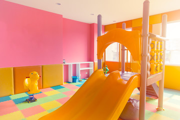 Indoor kids playground room for children play fun space in condominium.