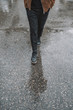 © Alex - Feet walking on wet asphalt with plaid pants