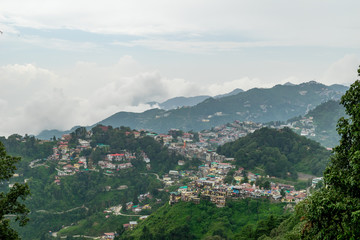 Wall Mural - a panoramic view of the mussoorie cityscape from landour, uttarakhand, india