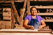 © Carlos David - Portrait of smiling woman working in tile factory in Mexico