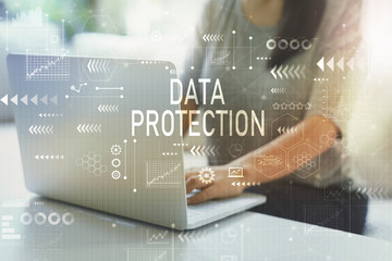 Wall Mural - Data protection with woman using her laptop in her home office