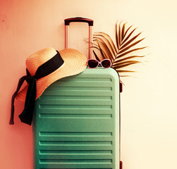 summer holidays travel background with siutcase and glasses