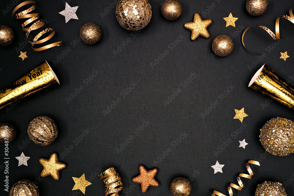 New Years Eve frame of glittery gold stars, streamers, decorations and ...