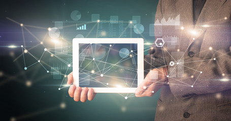 Poster - Elegant hand holding tablet with virtual database and network concept