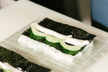 Sushi in the process of cooking in the kitchen, revealed