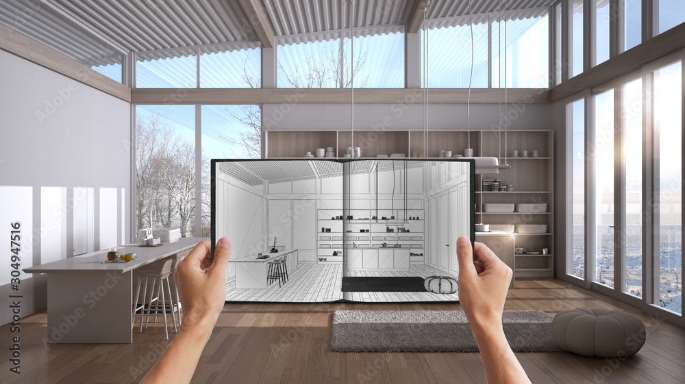 Hands holding notepad with creative kitchen design blueprint sketch or ...
