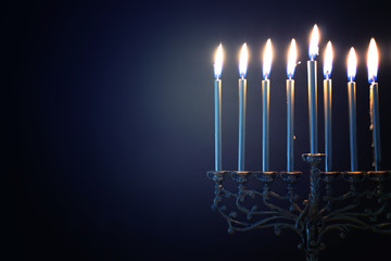 Religion image of jewish holiday Hanukkah background with menorah (traditional candelabra) and candles