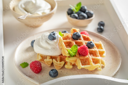 Cuadros en Lienzo Homemade waffles with berries and whipped cream