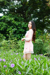 Portrait of beautiful young asian woman relaxing in garden