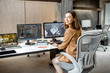 © rh2010 - Portrait of a young creative office employee making interior design, 3d modeling on the computer while sitting at the modern office of architectural firm