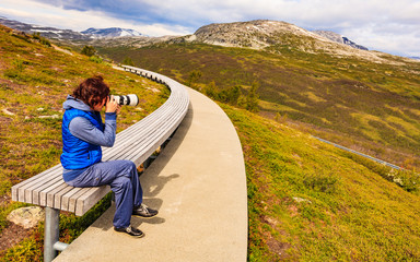 Wall Mural - Woman on Vedahaugane rest stop, Norway