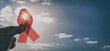Red ribbon symbol of AIDS and HIV disease.