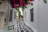Fototapeta Uliczki - Traditional small alleys at Parikia the port of Paros island, in Cyclades, Greece