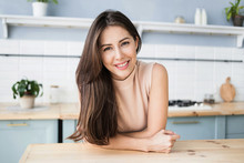 Beautiful Young Woman Relaxing At The Kitchen. Happy Smiling Girl Home Portrait. Resting, Relaxation And Leisure Concept