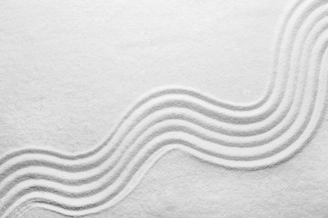 Wall Mural - White sand with pattern as background, top view. Zen, meditation, harmony