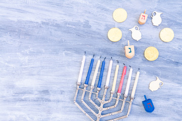 Menorah, dreidels and hanukkah coins with copy space. Menorah, dreidels and hanukkah coins with copy space. Hebrew translation: Letters: H, N