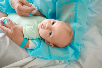 Wall Mural - Young woman with newborn baby in maternity hospital, closeup