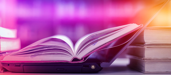 Poster - stack of books with laptop on table