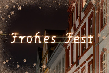 Poster - Street Decoration lights during a Christmas market stating merry christmas in german