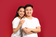 © Pixel-Shot - Portrait of happy young Asian couple on color background