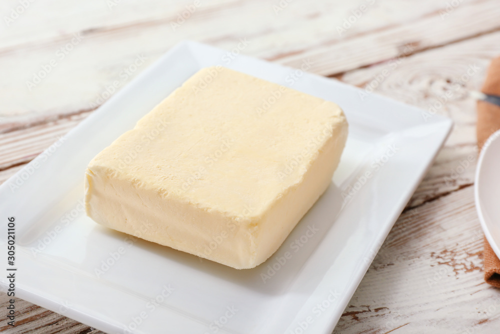 Tasty fresh butter on plate