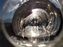 Drinking Pure Water From A Bottle At Sunrise. Point Of View Close Up.