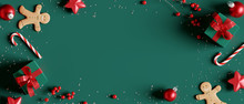 Christmas Decorations With Gift Box On Green Background. 3d Rendering