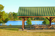 A Picnic Shelter In A Park By The Lake 