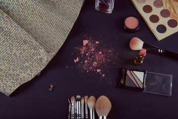 Isolated make-up powder with brush on black background